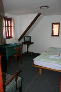 Postel nebo postele na pokoji v ubytování Penzion Novopacké Sklepy