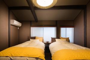 松原堺町纺织度假屋客房内的一张或多张床位