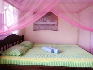 Giường trong phòng chung tại Novita Homestay