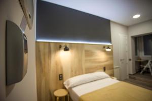 A bed or beds in a room at CC Atocha