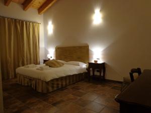 Postel nebo postele na pokoji v ubytování Agriturismo Le Case Di Campagna