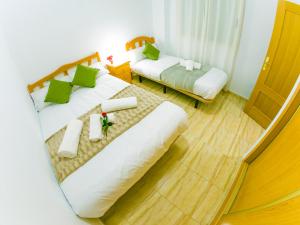 Postel nebo postele na pokoji v ubytování Homely Apartments Blasco Ibañez
