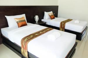 Postel nebo postele na pokoji v ubytování The Oasis Khaolak Resort - SHA Plus