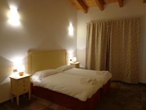 Postel nebo postele na pokoji v ubytování Agriturismo Le Case Di Campagna