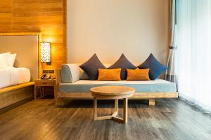 a living room with a couch and a table at AKIRA Lipe Resort in Ko Lipe