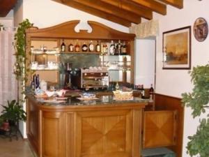 a kitchen with a counter in a room at Hotel Sogno in Rezzato
