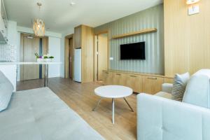 A television and/or entertainment centre at Aska Lara Resort & Spa Hotel