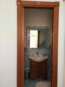 a bathroom with a sink and a mirror at Luna D'Agerola in Agerola