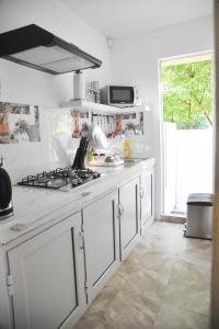 A kitchen or kitchenette at koeuris apartment