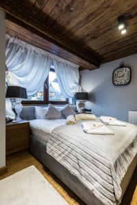 Posteľ alebo postele v izbe v ubytovaní Apartament Szymaszkowa Relax Ski Odkryj Zakopane