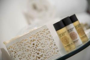 a shelf with two bottles of cosmetics on it at B&B Palazzo Montesanto in Maiori
