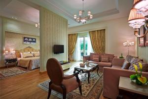 a large living room with a bed and a couch at Al Masa Hotel Nasr City in Cairo