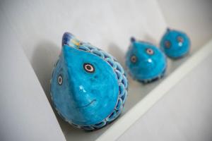 a group of blue vases sitting on a shelf at B&B Palazzo Montesanto in Maiori