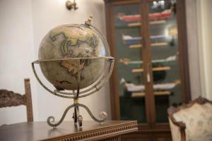 a glass globe sitting on top of a table at B&B Palazzo Montesanto in Maiori
