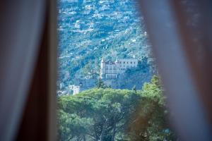 a view of a castle on top of a mountain at B&B Palazzo Montesanto in Maiori