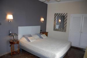 Postel nebo postele na pokoji v ubytování Hotel Grifeu