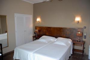 Postel nebo postele na pokoji v ubytování Hotel Grifeu