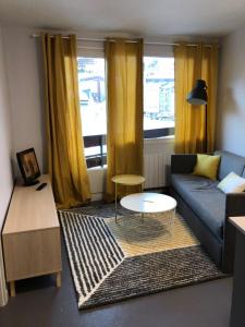 a living room with a couch and a table at The Site apartment in Pas de la Casa