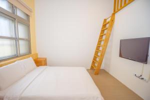 Llit o llits en una habitació de Colorful B&B