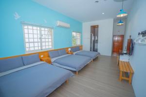 Llit o llits en una habitació de Colorful B&B