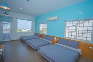 Postel nebo postele na pokoji v ubytování Colorful B&B