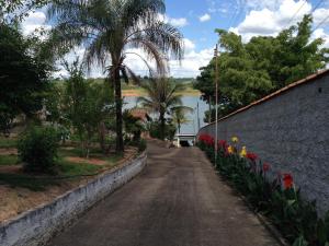 an empty street with flowers and a wall at Casa Tacumsol in Fama