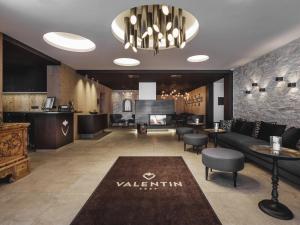 a living room with a couch and a fireplace at Valentin Design Apartments in Sölden