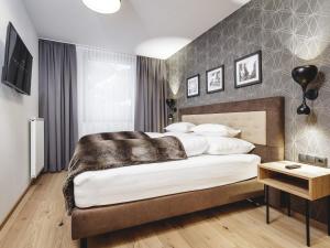 Posteľ alebo postele v izbe v ubytovaní Valentin Design Apartments