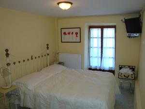 Postel nebo postele na pokoji v ubytování Guesthouse Kleopatra's
