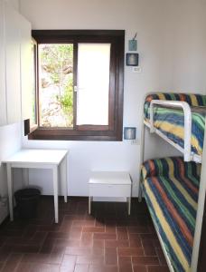 Letto o letti in una camera di Isola d'Elba Come in Barca, a un Tuffo dal Mare