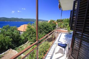 a balcony with a view of the water at Apartment Lile in Kučište