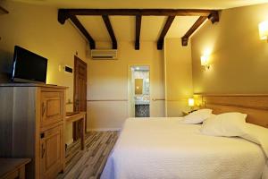 Cama o camas de una habitación en Hotel Alda A Boira