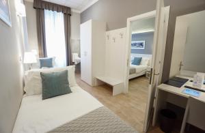 Posteľ alebo postele v izbe v ubytovaní Nuovo Albergo Centro