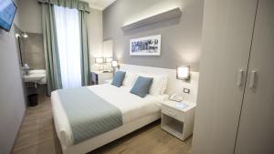 Posteľ alebo postele v izbe v ubytovaní Nuovo Albergo Centro