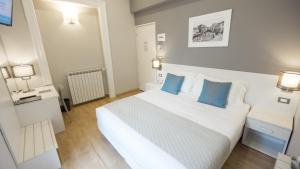 Posteľ alebo postele v izbe v ubytovaní Nuovo Albergo Centro