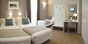 Posteľ alebo postele v izbe v ubytovaní Nuovo Albergo Centro