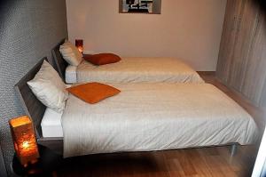 Ліжко або ліжка в номері Au Marronnier