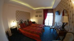 Rúm í herbergi á Hotel Mirto