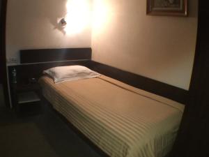 מיטה או מיטות בחדר ב-Hotel Kilometrul Zero