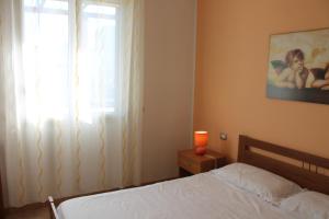 Postel nebo postele na pokoji v ubytování Residence Jonico