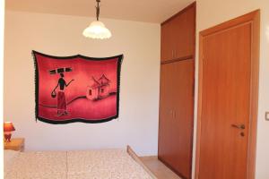 Postel nebo postele na pokoji v ubytování Residence Jonico