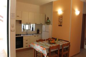 Kuchyň nebo kuchyňský kout v ubytování Residence Jonico