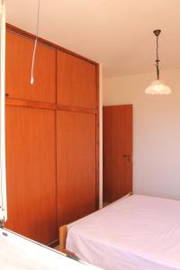 Postel nebo postele na pokoji v ubytování Residence Jonico