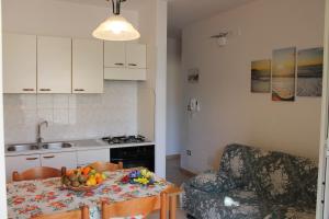 Kuchyň nebo kuchyňský kout v ubytování Residence Jonico