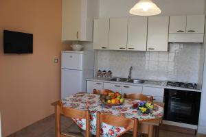Kuchyň nebo kuchyňský kout v ubytování Residence Jonico