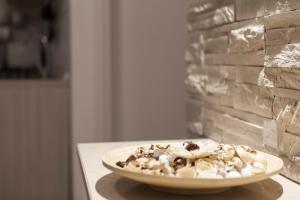 a plate of food sitting on a table at Blunotte Suite in Potenza +2 photos