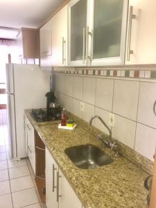 Kuchyň nebo kuchyňský kout v ubytování Duplex Borges De Medeiros + 83 fotografií