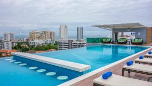 a large swimming pool on the roof of a building at Unique Regency Pattaya in Pattaya South
