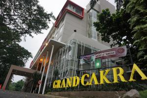 a building with a sign in front of it at Grand Cakra Hotel Malang in Malang +26 photos