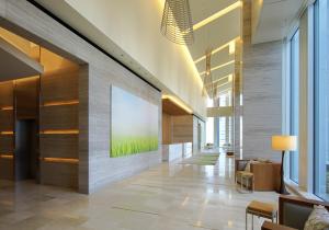 a lobby with a large painting on a wall at Nagoya JR Gate Tower Hotel in Nagoya